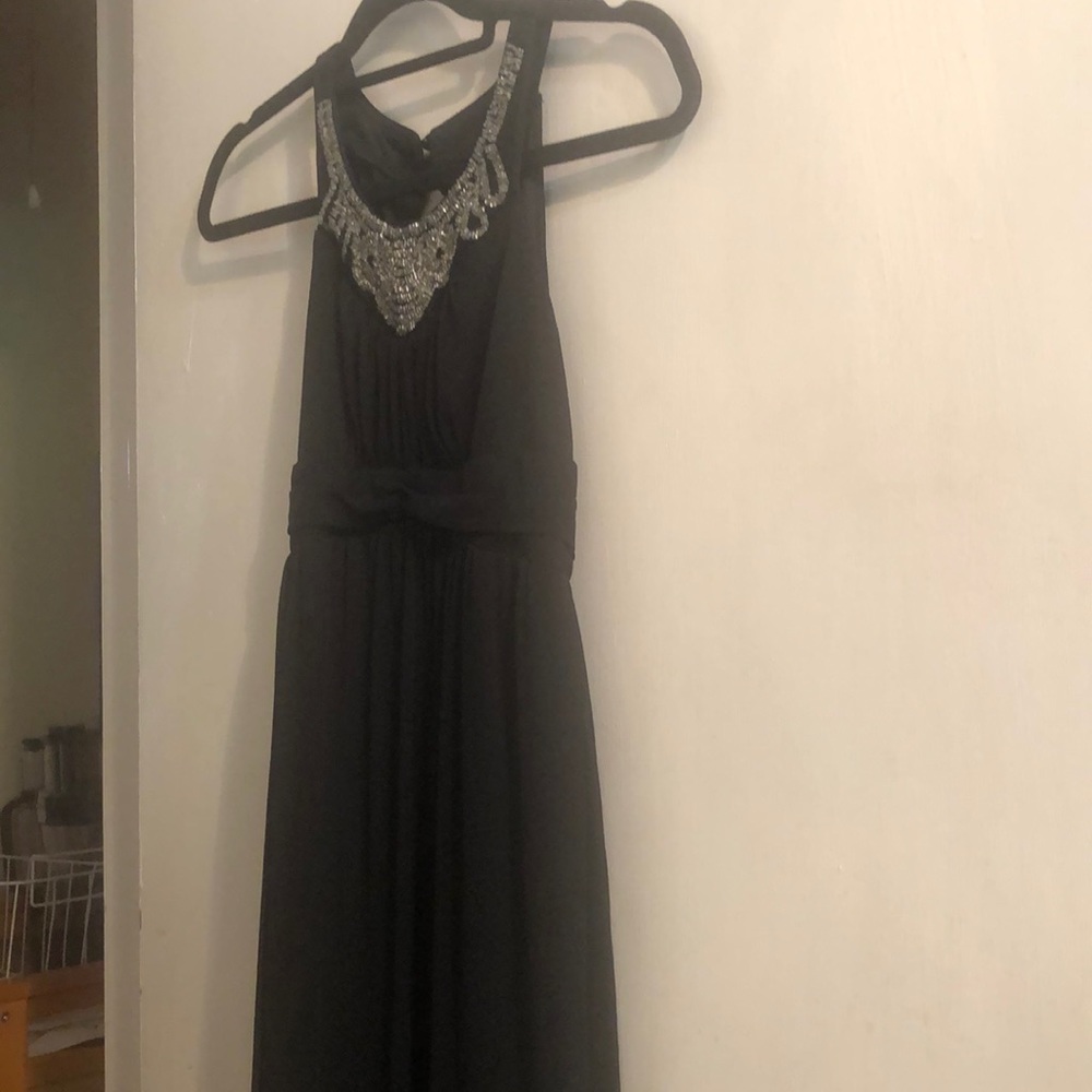 Emerald Sundae long black beaded I would say formal dress with tie in back.